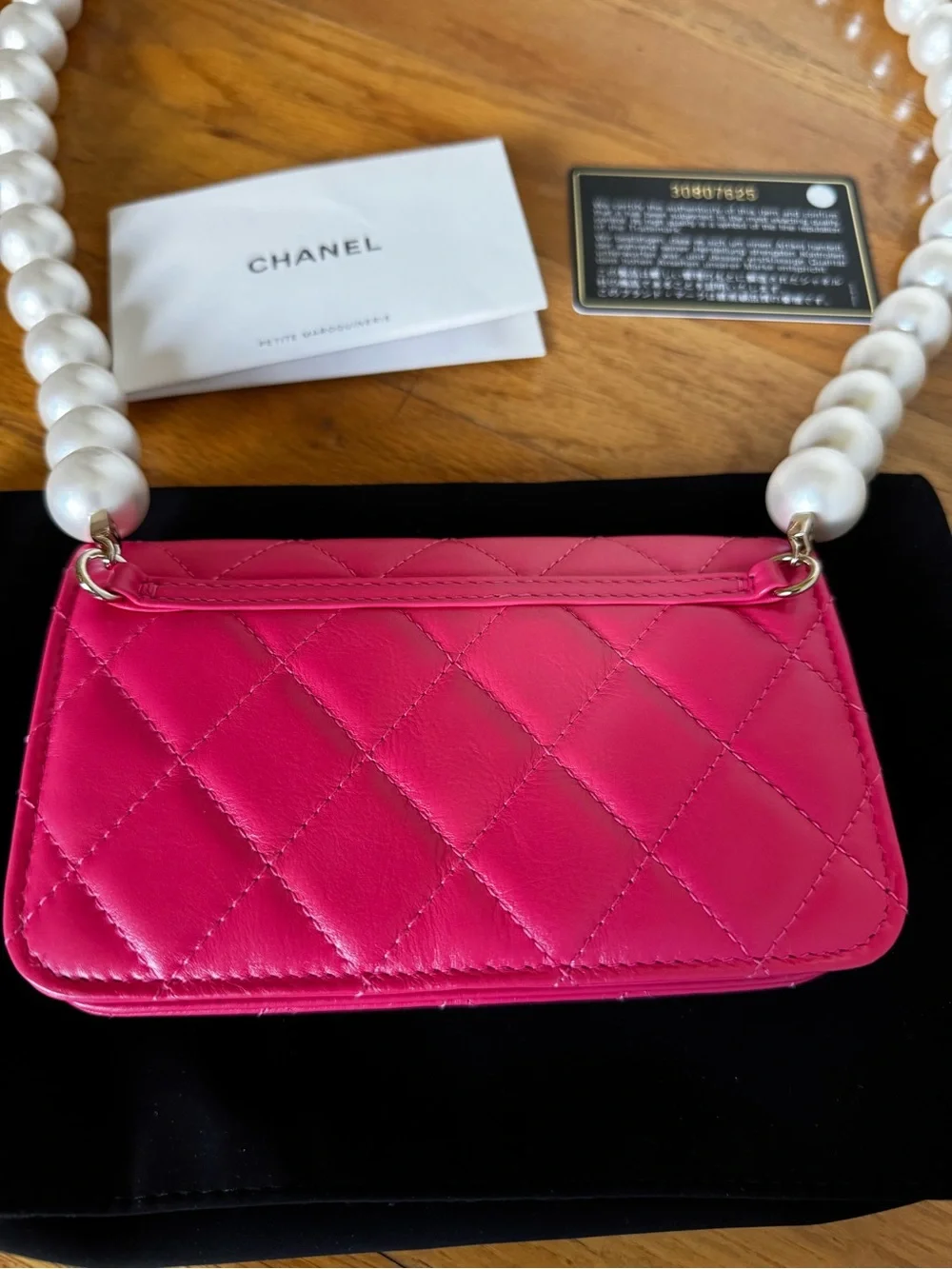 CHANEL Hot Pink Quilted Mini Wallet with Pearl Chain